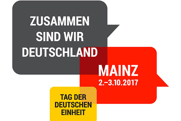 Das Logo ist unterteilt in drei Sprechblasen, in den Farben der deustche Flagge, und bedruckt mit den Rahmendaten des Tages der Deutschen Einheit.